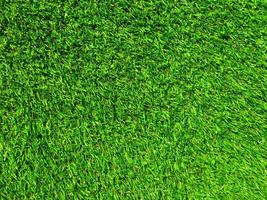 Artificial green grass texture background with copy space for work and design. photo