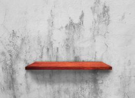 Rustic wooden shelf on grey concrete wall texture background with clipping path. pattern wallpaper photo