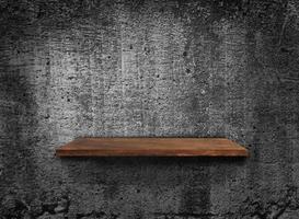 Blank of old wooden shelf on dark wall texture background with clipping path for design photo