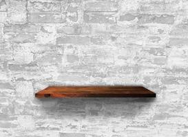 Rustic wooden shelf on grey concrete wall texture background with clipping path. pattern wallpaper photo