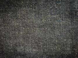 Black denim texture background with copy space for design photo