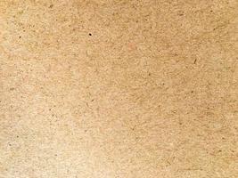 Old brown paper texture background or cardboard with copy space for design. photo