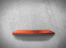 Top view of wood shelves on concrete wall texture background with clipping path for design photo