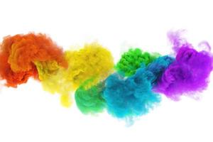 Funny clouds of colored rainbow smoke in white background photo