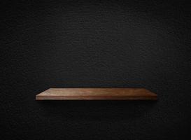 Light wood shelves on black wall texture in loft Style  background with clipping path. Design for wallpaper photo