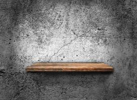 Blank of old wooden shelf on dark wall texture background with clipping path for design photo