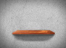 Top view of wood shelves on concrete wall texture background with clipping path for design photo