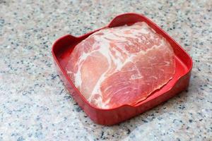 Sliced pork was served in Shabu, Sukiyaki or grill restaurant and dip with sauce. photo