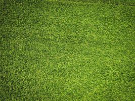 Artificial grass background for design, top view photo