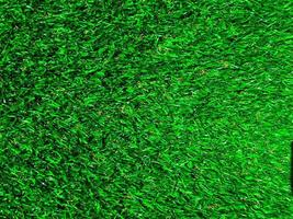 Artificial green grass texture background with copy space for work and design. photo