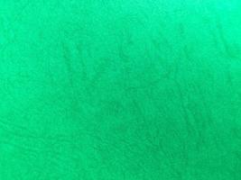 Green paper texture background with pattern for design. Copy space for text and work photo