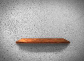 Top view of wood shelves on concrete wall texture background with clipping path for design photo