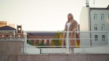 Portrait, Happy Business Woman in a Brown Coat Walks in the City Autumn Park. Career People. Fashion, Beauty. Female Portraits. Real People. Slow Motion video