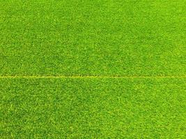 Artificial grass background for design, top view photo