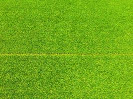 Artificial grass background for design, top view photo