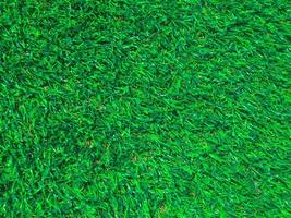 Artificial green grass texture background with copy space for work and design. photo