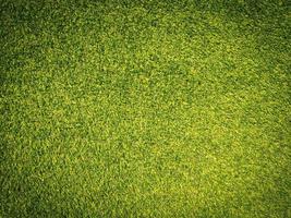 Artificial grass background for design, top view photo