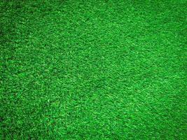 Modern green lawn texture background. Wallpaper for work and design. photo