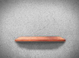 Top view of wood shelves on concrete wall texture background with clipping path for design photo