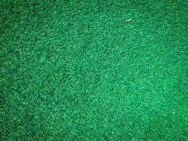 fondo de textura de hierba verde artificial con espacio de copia para el trabajo y el diseño. foto