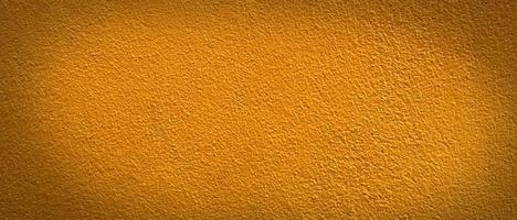 Empty yellow cement wall texture background with pattern and copy space for design photo