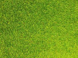 Artificial grass background for design, top view photo