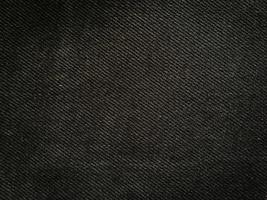 Black denim texture background with copy space for design photo