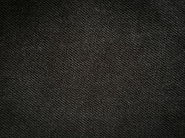 Black denim texture background with copy space for design photo