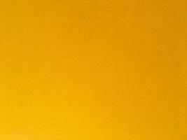 Yellow paper texture background for design. Wallpaper with copy space photo