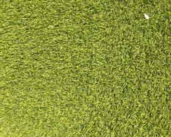 Artificial green grass texture background with copy space for work and design. photo