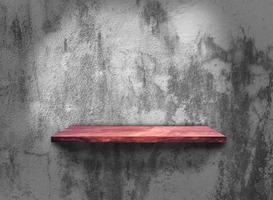 Rustic wooden shelf on grey concrete wall texture background with clipping path. pattern wallpaper photo