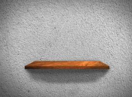 Top view of wood shelves on concrete wall texture background with clipping path for design photo