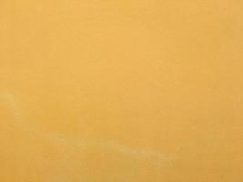 Yellow wall texture background for design with copy space photo