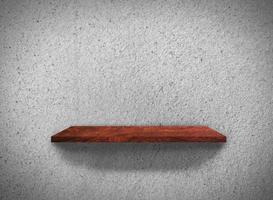 Top view of wood shelves on concrete wall texture background with clipping path for design photo