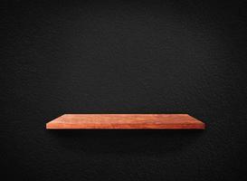 Light wood shelves on black wall texture in loft Style  background with clipping path. Design for wallpaper photo