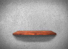 Top view of wood shelves on concrete wall texture background with clipping path for design photo