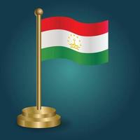 Tajikistan national flag on golden pole on gradation isolated dark background. table flag, vector illustration