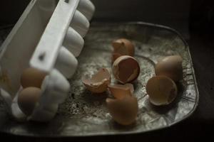 Broken eggs. Eggshell. Chicken eggs are on table. Food Details. photo