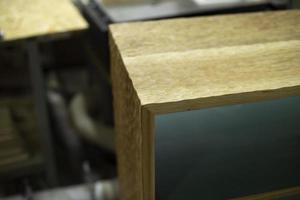 Manufacture of furniture in carpentry workshop. Wooden wardrobe. Original product. photo
