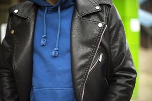 Black leather jacket. Blue jacket. Fashionable clothes. Man in jacket. photo