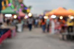 blur festival pedestrian market shopping street for abstract background. photo