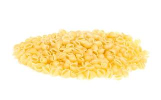 Heap of raw pasta on white background photo