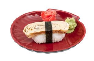 Tamago Omelet sushi on the plate and white background photo