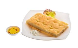 Olive bread on the plate and white background photo