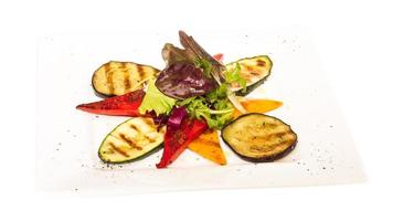 Grilled vegetables on the plate and white background photo