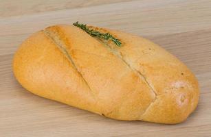 Baguette bread on wooden background photo