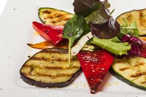 Grilled vegetables on the plate and white background photo