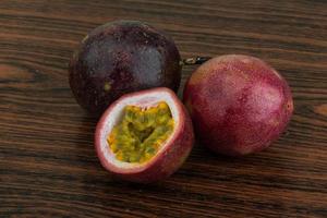 Passion fruit on wooden background photo