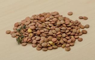 Dry Lentil on wooden background photo