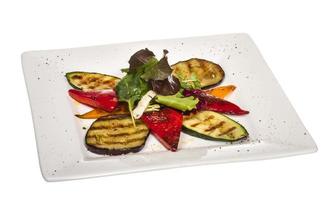 Grilled vegetables on the plate and white background photo